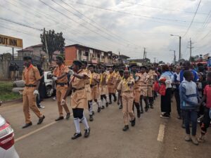 Hundreds of scout and other pupils marching in Ndumberi during Bridget Njoki burial ceremony