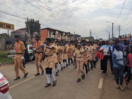Hundreds of scout and other pupils marching in Ndumberi during Bridget Njoki burial ceremony